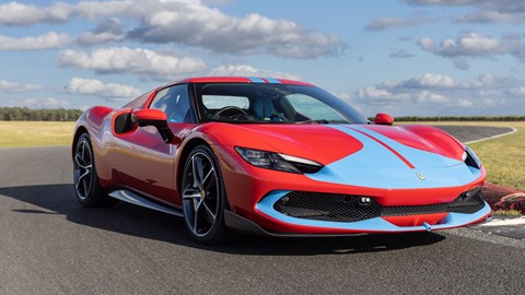 Best hybrids: Ferrari 296 GTB, front view, driving, red with blue nose and stripes