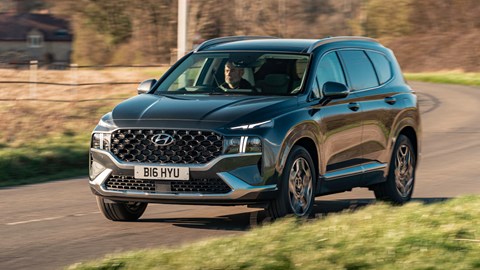 Best hybrids: Hyundai Santa Fe, front view, driving in countryside